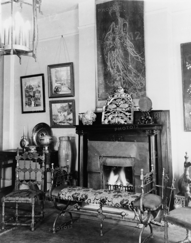 Fireplace, furniture, and works of art in Frances Benjamin Johnston's..., New Orleans, c1920 - 1950. Creator: Frances Benjamin Johnston.