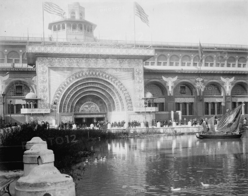 Transportation exhibit building with canal boat and ducks on canal(?) in foreground..., 1893. Creator: Frances Benjamin Johnston.