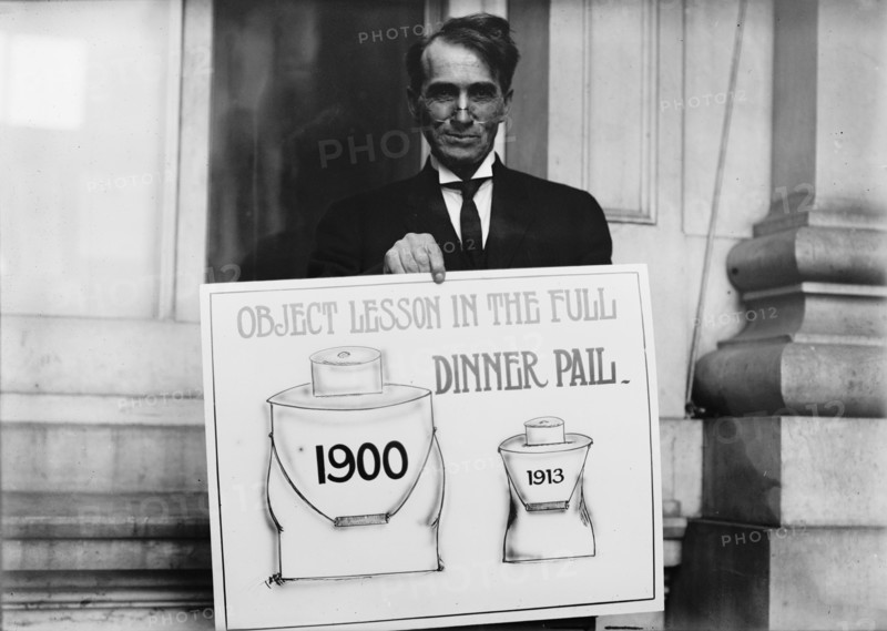 Theron Akin, Rep. from New York; with 'Full Dinner Pail' Placard, 1913. Creator: Harris & Ewing.
