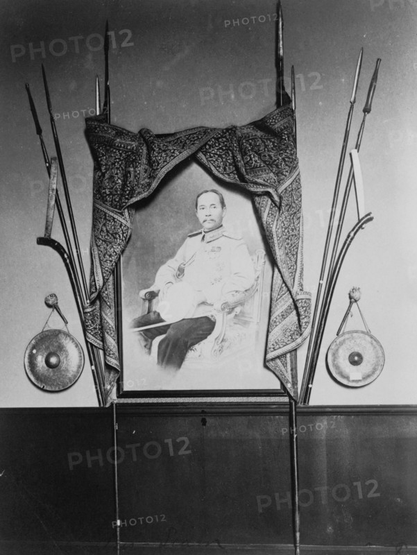 Display with portrait of a man, possibly Chulalongkorn, King of Siam, in Siam exhibit..., 1904. Creator: Frances Benjamin Johnston.