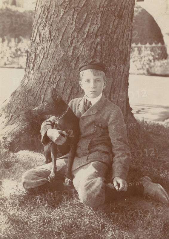 Kermit Roosevelt and Jack, the dog, 1902. Creator: Frances Benjamin Johnston.