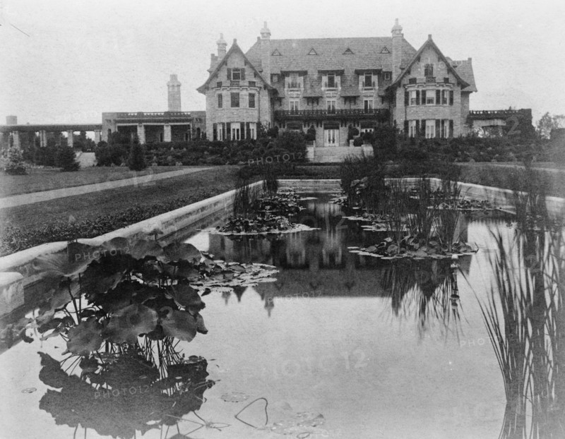 Facade of home of Edmund Cogswell Converse, with lily pond in..., Greenwich, Connecticut, 1908. Creator: Frances Benjamin Johnston.