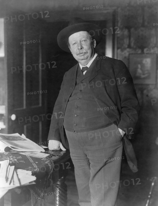 Joel Chandler Harris, three-quarter-length portrait, standing, facing slightly left, c1890 and 1910. Creator: Frances Benjamin Johnston.