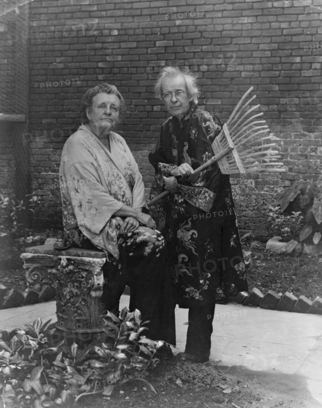 Frances B. Johnston in garden in New Orleans with "Pops" Whitesell, who is holding..., c1945 - 1952. Creator: Frances Benjamin Johnston.
