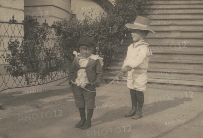 Quentin Roosevelt and Roswell Pinckney at play, c1902 June 17. Creator: Frances Benjamin Johnston.