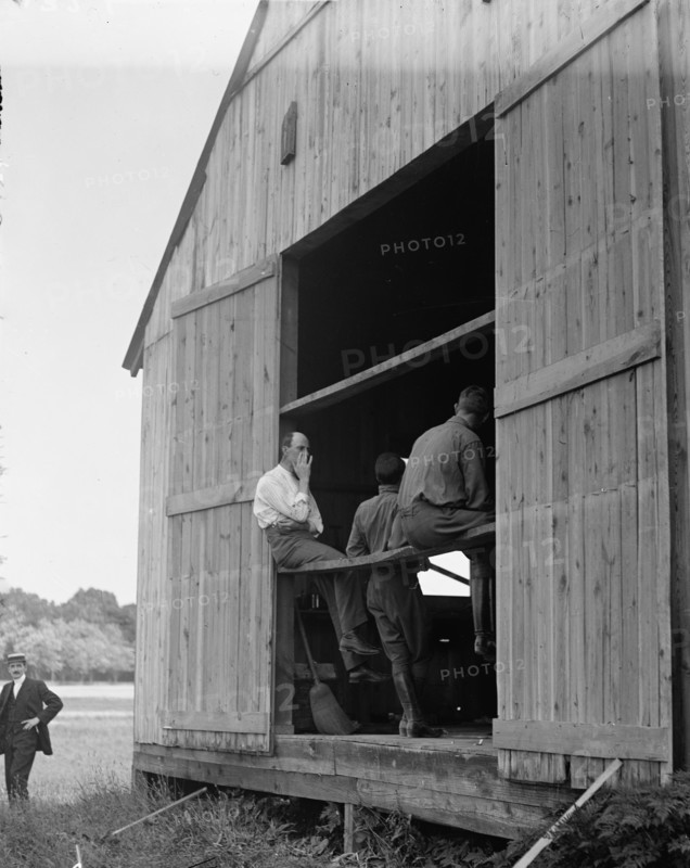Wright Flights, Fort Myer, Va, July 1909 - Hangar, Wilbur Wright, Right, Showing His Objection To... Creator: Harris & Ewing.