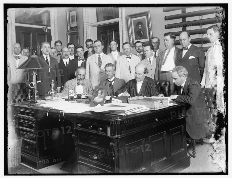 Group: includes William Jennings Bryan (at desk, 2nd from right)..., between 1910 and 1920. Creator: Harris & Ewing.