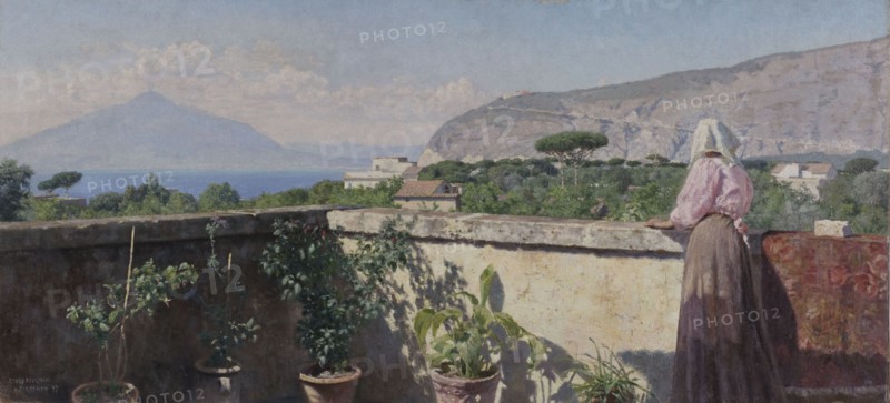 Woman on the terrace of the Cocumella hotel. View of Vesuvius, 1897.