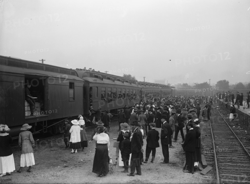 Army, U.S. Troops In Training, 1917. Crowds waving off a train packed with soldiers.