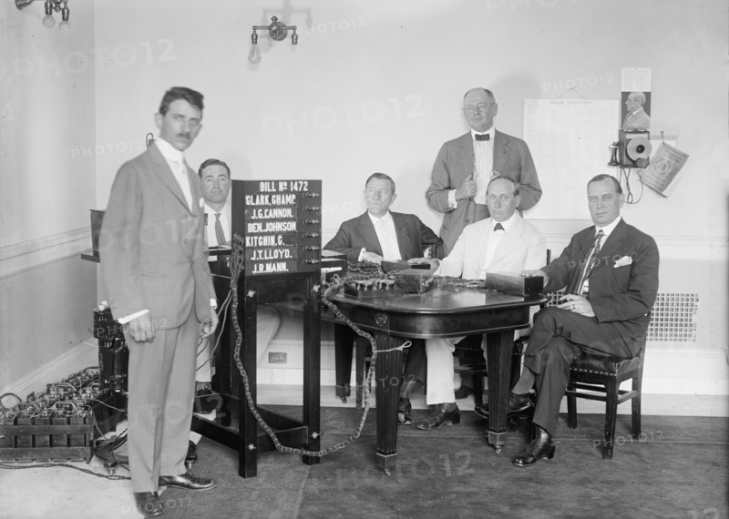 Bobroff Voting Machine - Being Considered For Use In House, Standing Right To Left: Reps..., 1917. Creator: Harris & Ewing.