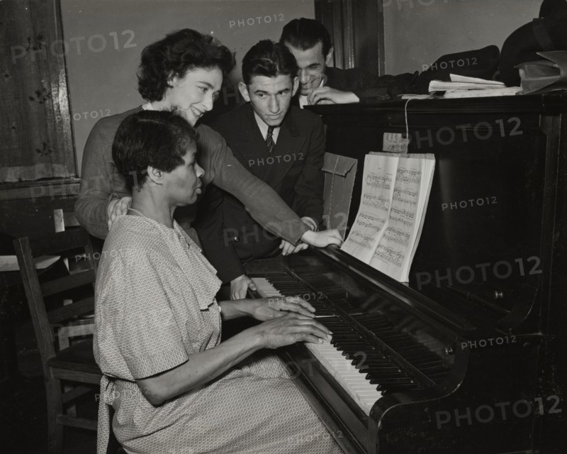 Teacher and student at piano, Jewish Settlement, 1938.