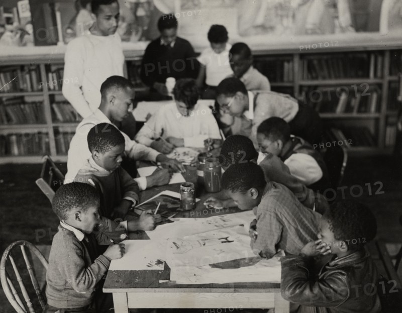 Oliver Harrington supervises class studying mural work, Hudson Ave Boys' Club, 1936.