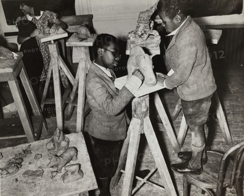 Boys sculpting a horse, Harlem Community Art Center, 1937.