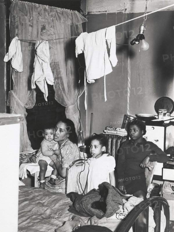 Negro family living in crowded quarters, Chicago, Illinois, April 1941.
