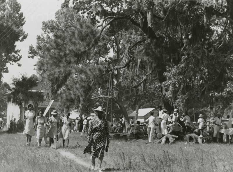 African Americans walking in an open field at a picnic, Beaufort, South Carolina, July 4, 1939.