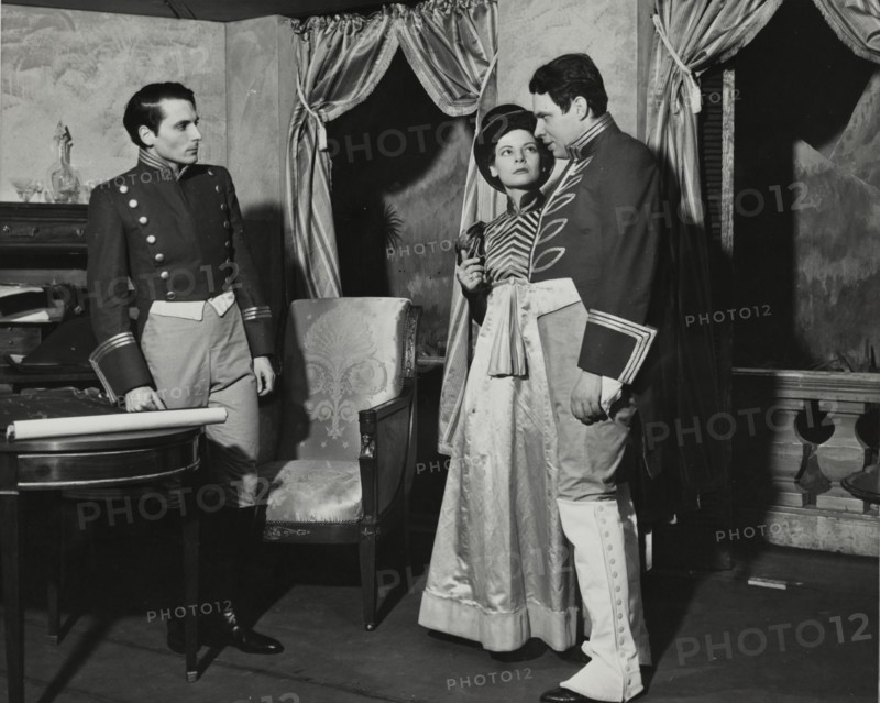 Two men and a woman, standing, 1938.