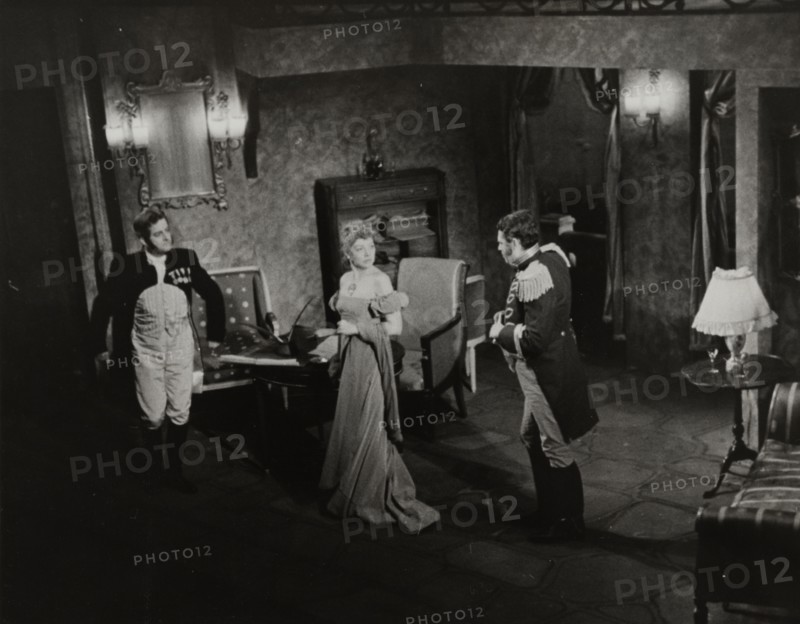 Two men and woman in evening dress, 1938.