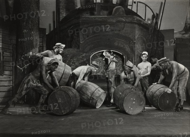 Men moving barrels, 1936.