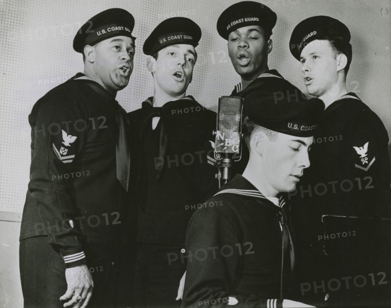 Group photograph of the U.S. Coast Guard Quartet members while singing, New York, N.Y., 1939 - 1945.