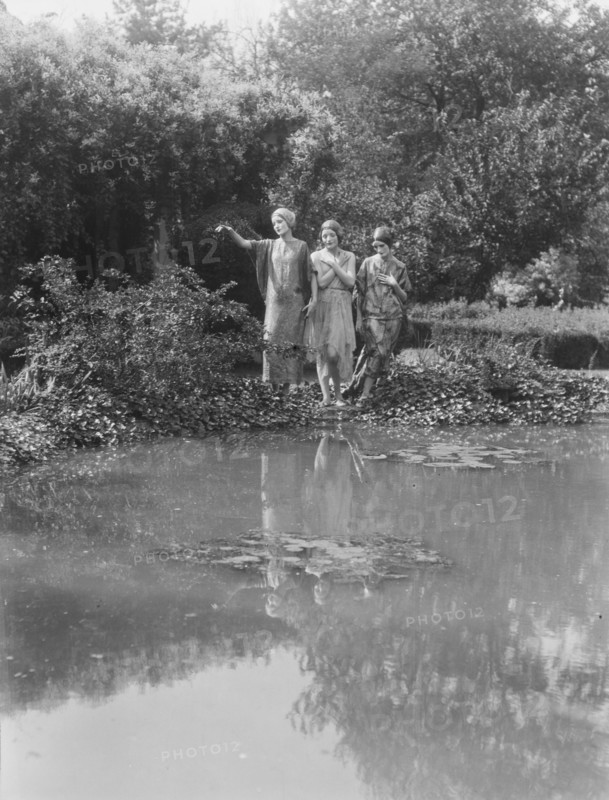 People wearing masks made by W.T. Benda, 1925 Sept. 20. Creator: Arnold Genthe.