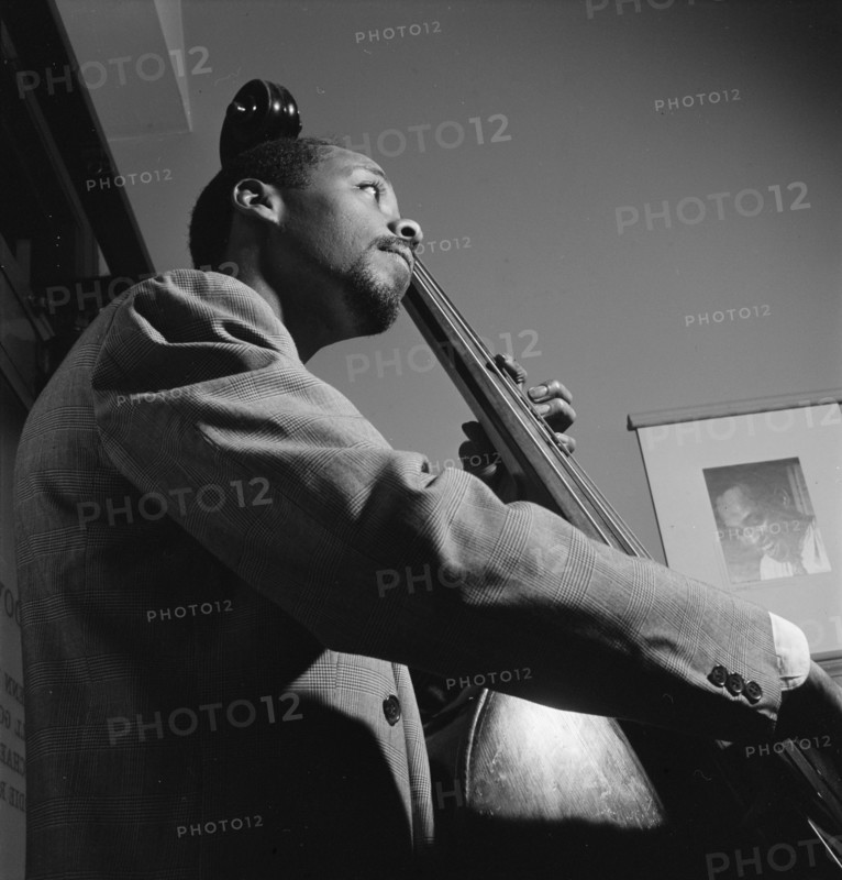 Portrait of John Simmons, William P. Gottlieb's office, New York, N.Y., ca. July 1947. Creator: William Paul Gottlieb.