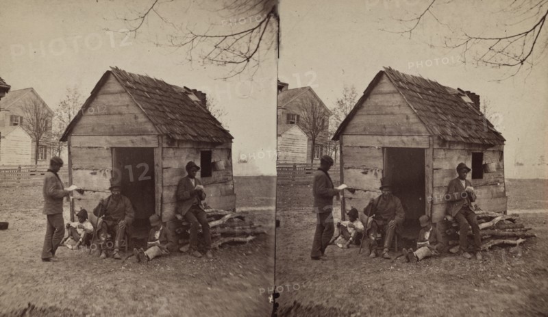 School house. [Man in a top hat in front of a shack with several boys with books], (1868-1900?). Creator: J. N. Wilson.
