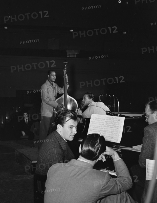 Portrait of Eddy Duchin, Wesley Prince, Nat King Cole, and Oscar Moore, New York, ca. July 1946. Creator: William Paul Gottlieb.