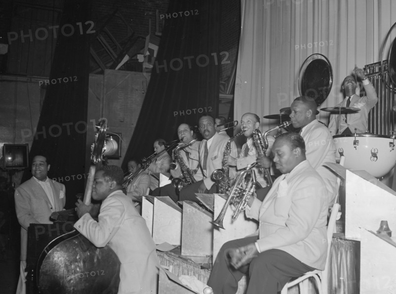 Portrait of Duke Ellington, Junior Raglin, Tricky..., Howard Theater(?), Washington, D.C., 1938. Creator: William Paul Gottlieb.