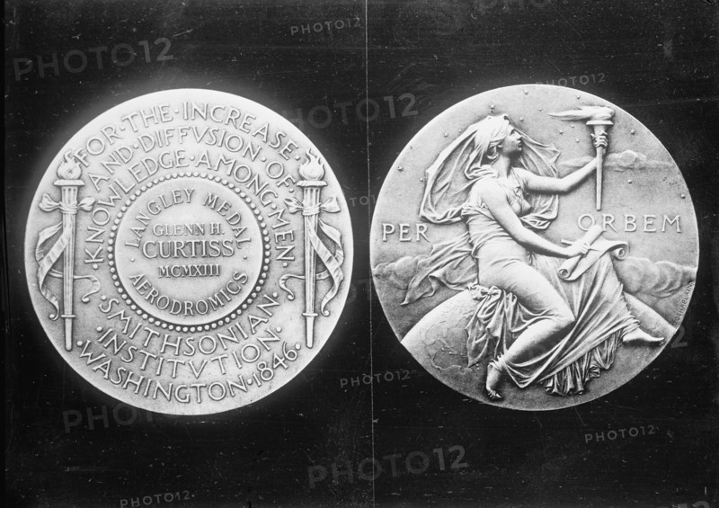 Langley Medal presented to aviator Glenn Hammond Curtiss, 1913. Creator: Harris & Ewing.
