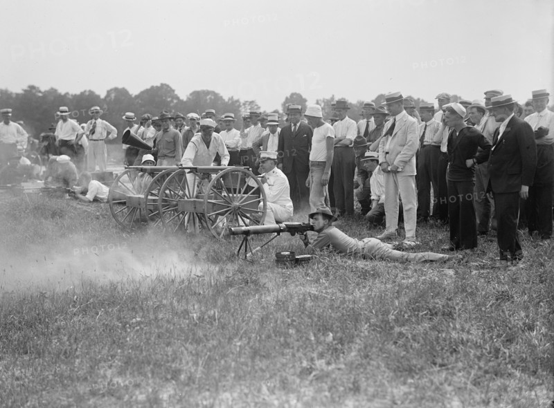 Marine Corps Rifle Range, Winthrop, Md. - Gen. Barnett Testing Colt's Automatic Machine Gun, 1917. Creator: Harris & Ewing.