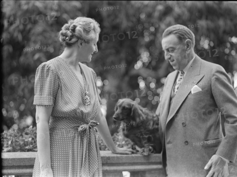 Alanson, Bertram, Mr. and Mrs., with dog, outdoors, between 1927 and 1937. Creator: Arnold Genthe.