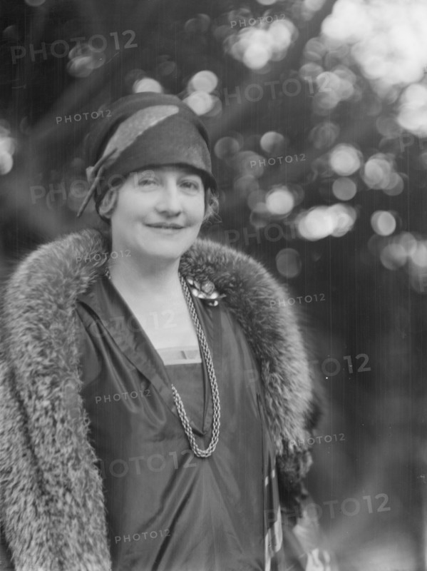 Alanson, Bertram, Mrs., standing outdoors, between 1927 and 1937. Creator: Arnold Genthe.