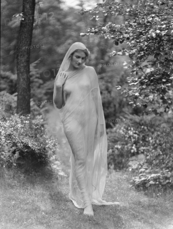 Egger, Gabrielle, Miss, standing outdoors, between 1926 and 1930. Creator: Arnold Genthe.