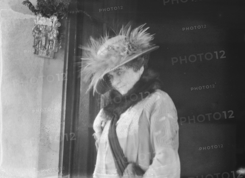 Slater, Mrs., standing by the door of a house in Long Beach, 1924 July. Creator: Arnold Genthe.