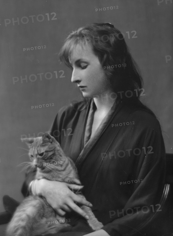Whittaker, Miss, with Buzzer the cat, portrait photograph, 1916. Creator: Arnold Genthe.