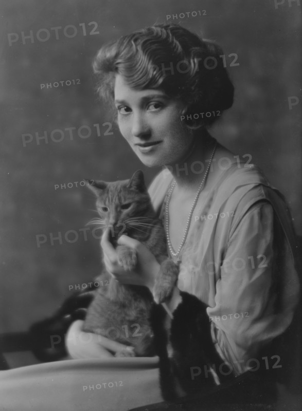 Bainter, Fay, Miss, with Buzzer the cat, portrait photograph, 1916. Creator: Arnold Genthe.