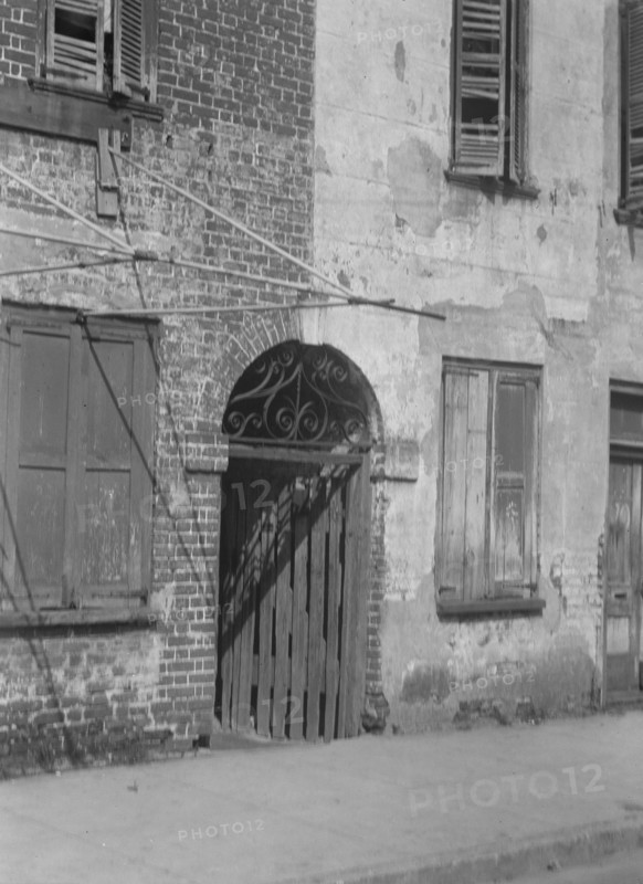 Facades of multi-story buildings, New Orleans or Charleston, South Carolina, between 1920 and 1926. Creator: Arnold Genthe.