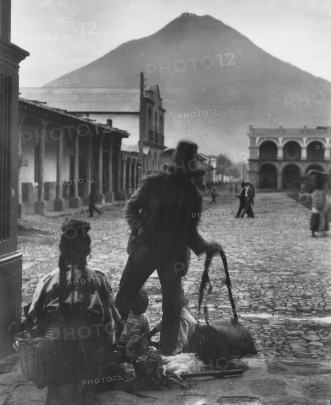 Plaza and volcano of Antigua, Guatemala, between 1899 and 1926. Creator: Arnold Genthe.