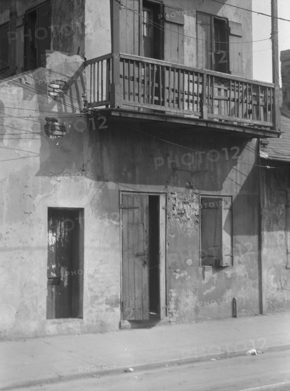 Facade of a multi-story house in the French Quarter, New Orleans, between 1920 and 1926. Creator: Arnold Genthe.