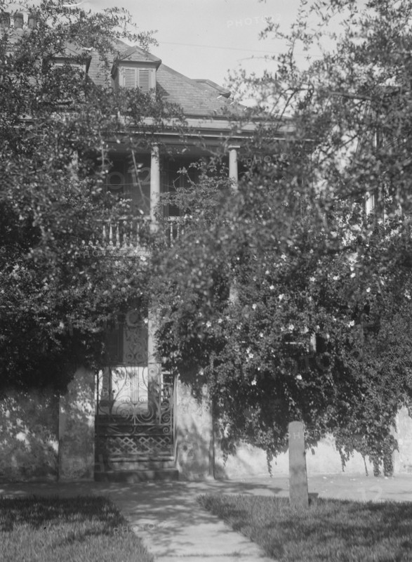 Multi-story house behind trees, [George Eveleigh House, 39 Church Street], Charleston..., c1920-1926 Creator: Arnold Genthe.