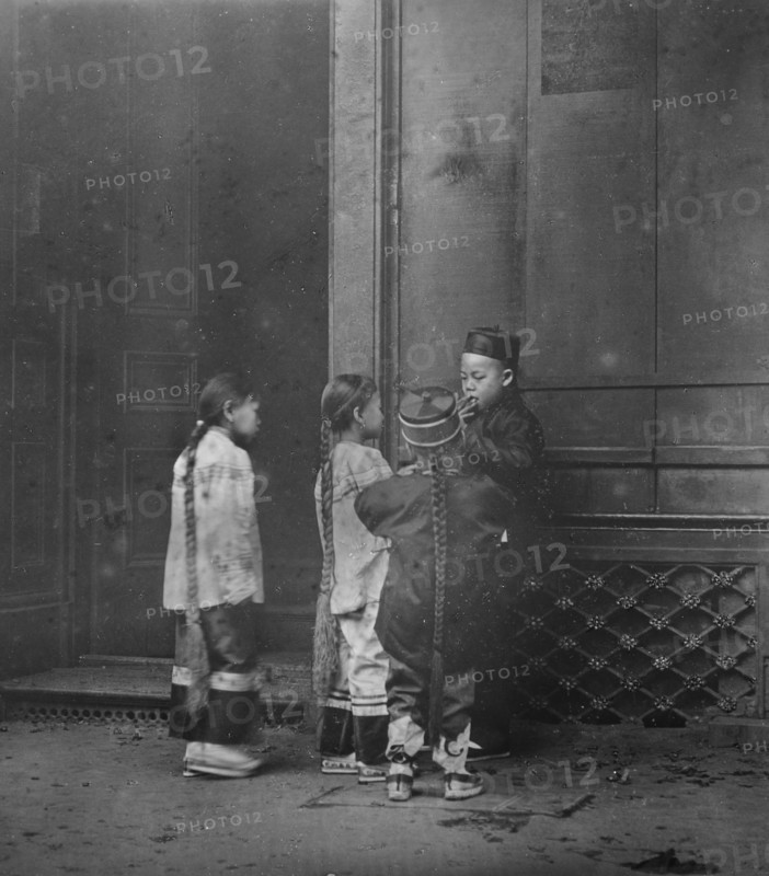 His first cigar, Chinatown, San Francisco, between 1896 and 1906. Creator: Arnold Genthe.