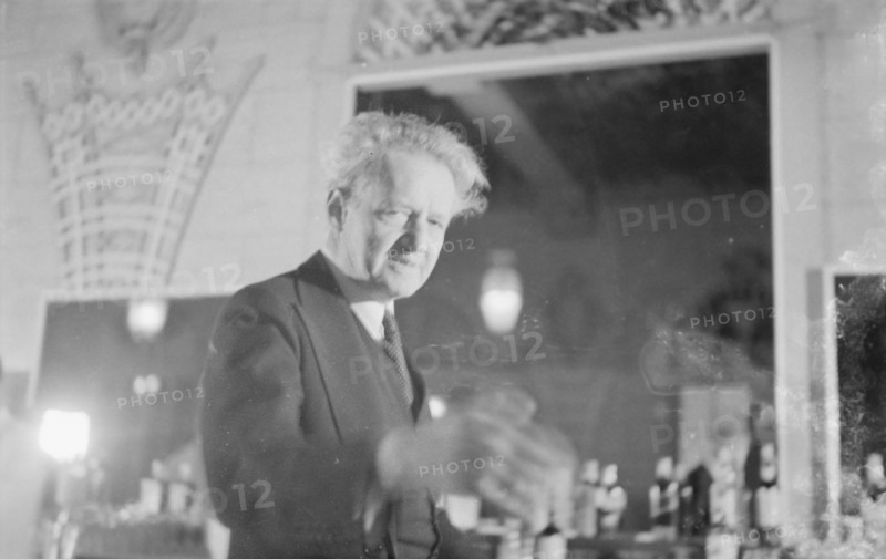 Arnold Genthe at a party, restaurant, or nightclub, between 1911 and 1942. Creator: Arnold Genthe.