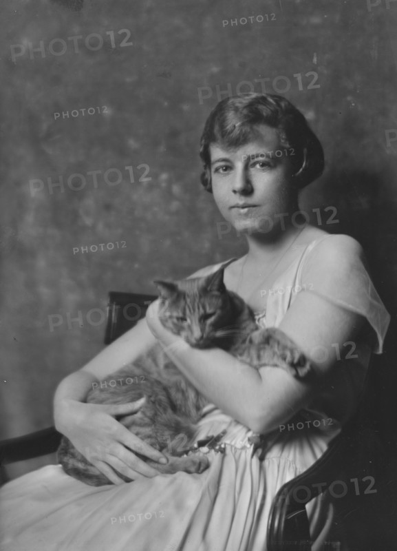 Miss Marjorie Cluett, with Buzzer the cat, portrait photograph, 1917 Dec. Creator: Arnold Genthe.