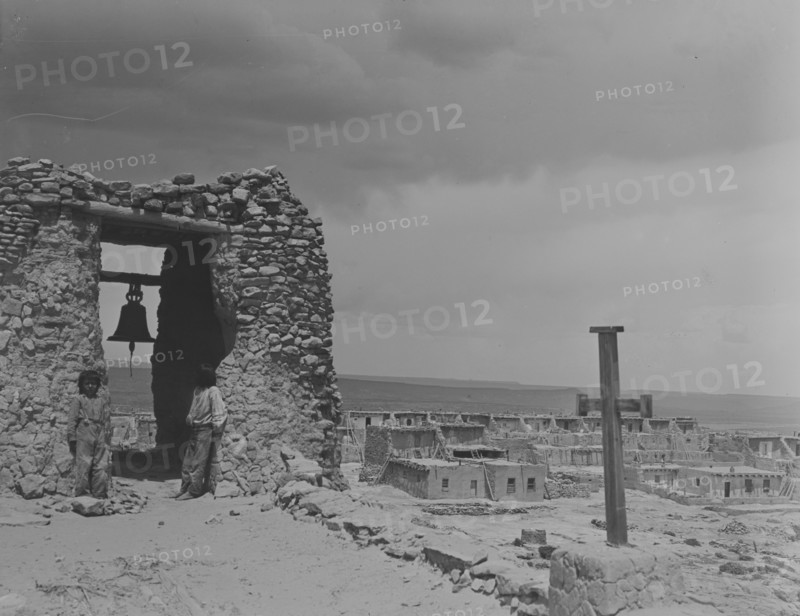 North American Indian children on roof of San Estevan Mission, Acoma Pueblo, New Mexico, c1899-c1928 Creator: Arnold Genthe.
