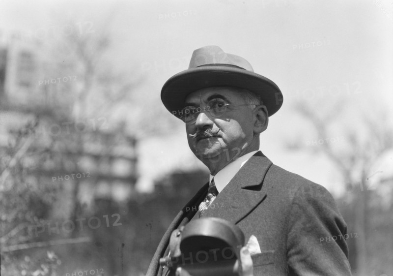 Dr. Maximilian Toch, standing outdoors, 1936. Creator: Arnold Genthe.