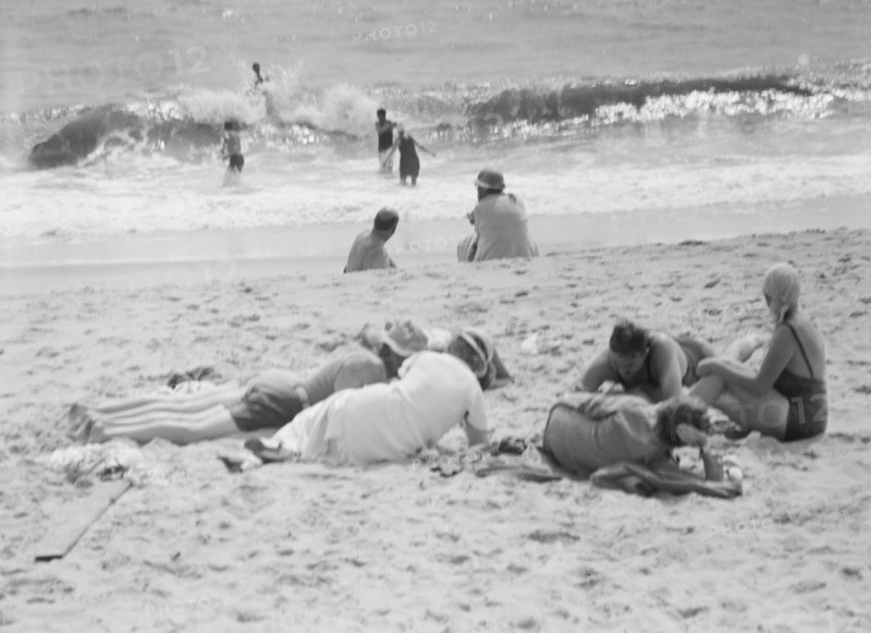 Unidentified group of people, possibly members of the Jewett family, at the beach, c1911-1942. Creator: Arnold Genthe.