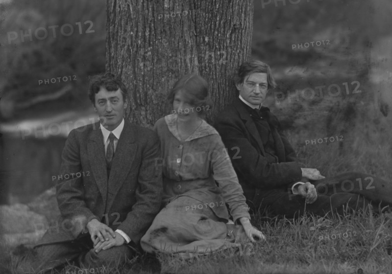 Millay, Edna St. Vincent, Miss, with Bliss Carman and George Sterling, seated against a tree, 1914. Creator: Arnold Genthe.