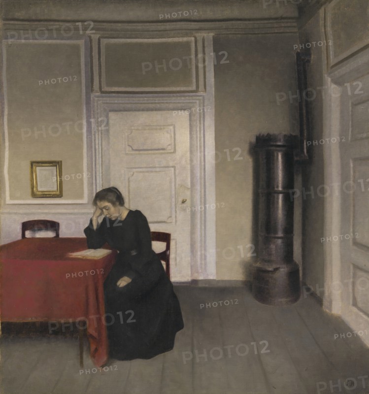 A Room in the Artist's Home in Strandgade, Copenhagen, with the Artist's Wife, 1902. Creator: Vilhelm Hammershøi.