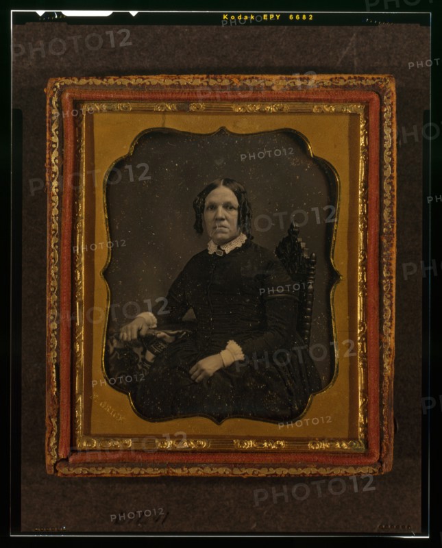 Unidentified woman, three-quarters length portrait, seated in chair with right arm..., ca. 1855. Creator: Francis Grice.