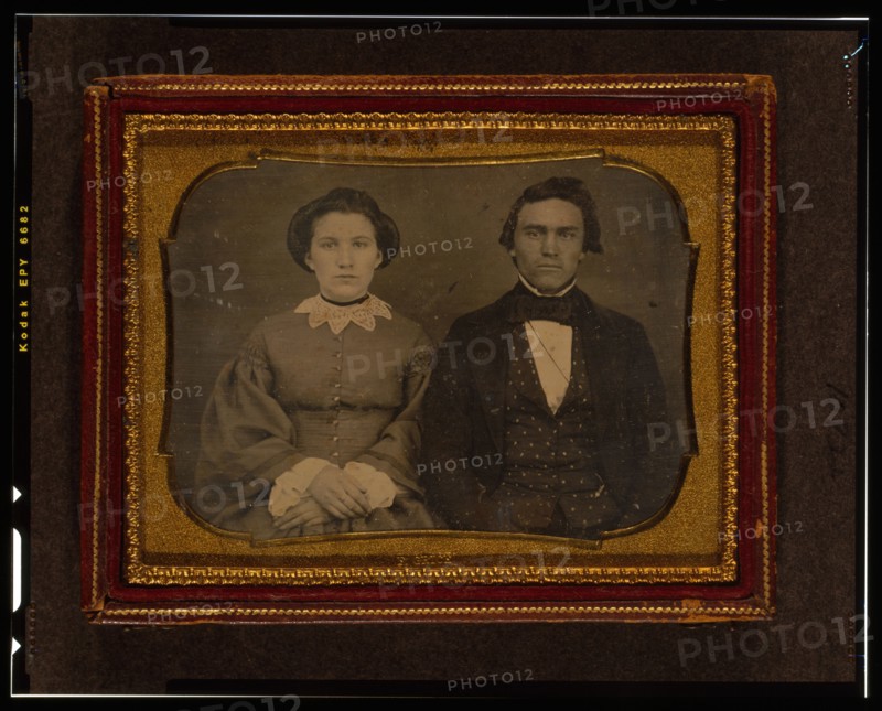 Unidentified man and woman, half-length portrait, seated, ca. 1855. Creator: Francis Grice.